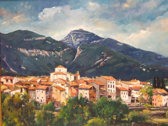 Vila de Tortellà amb la muntanya del Santuari del Mónt al fons Fotografia: Lejarza (Argelaguer) treta d'un quadre